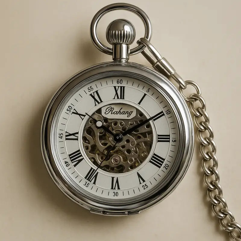 Reloj de bolsillo automático plateado con cadena, elegancia mecánica atemporal